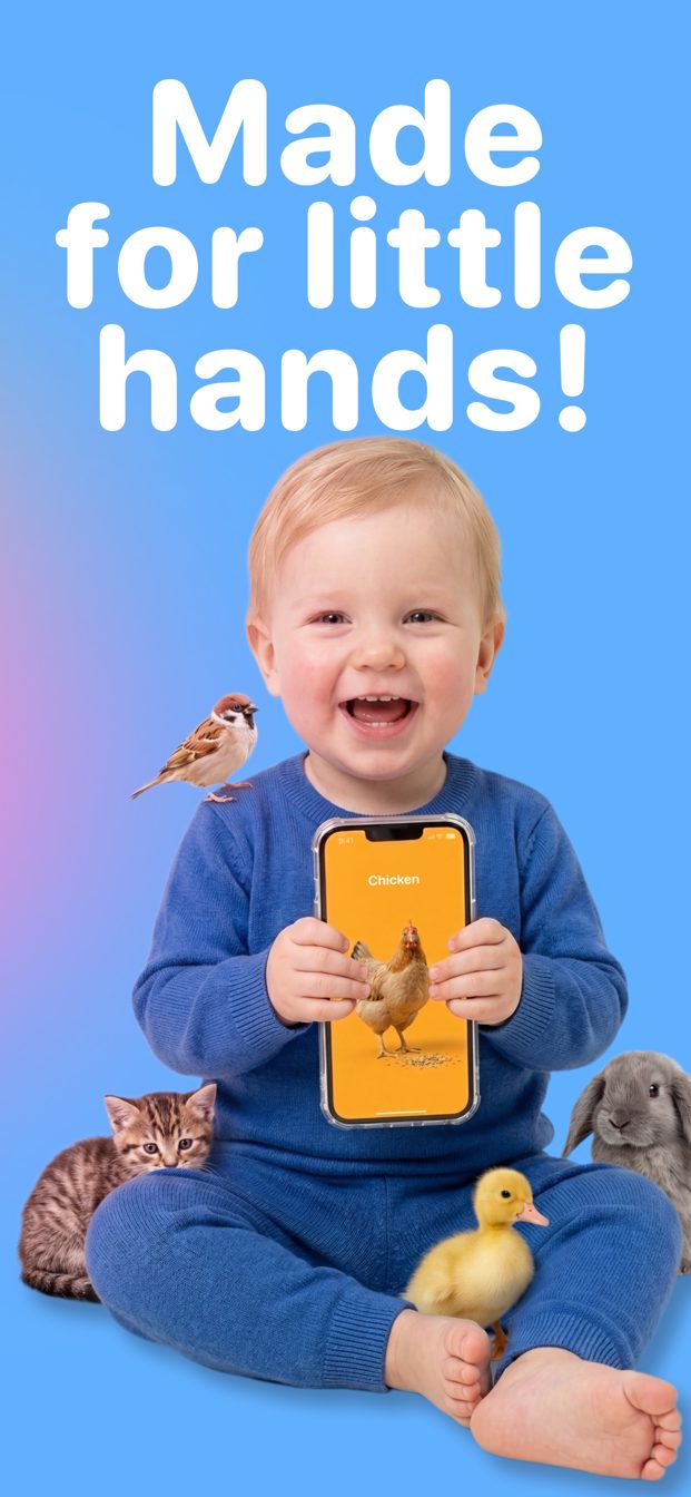 A toddler holding a phone with First Tap: Animals